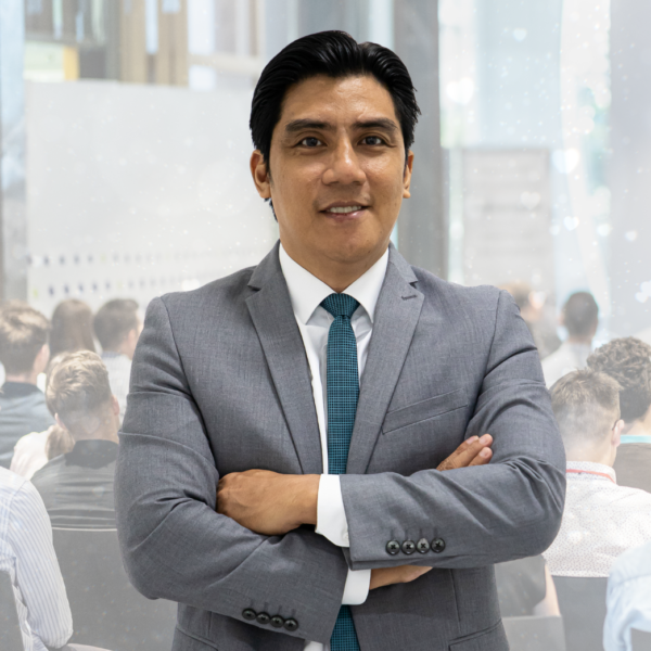 "Sales Director Ace Gem Guevara posing for a corporate photo with the JBC team"