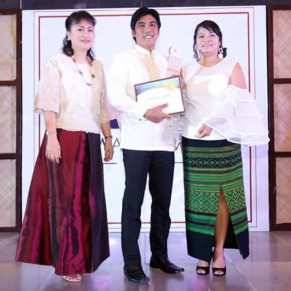"Sales Director Ace Gem Guevara receiving the Gawad Lumina award in 2017"