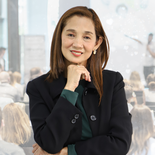 "A professional headshot of Sales Director Maria Lourdes J. Santiago, wearing business attire, smiling confidently."
