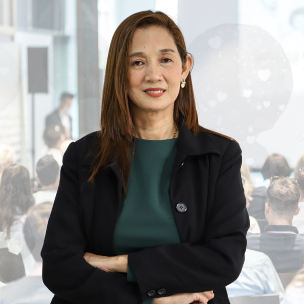 "A formal portrait of Sales Director Maria Lourdes J. Santiago in professional attire, showing a poised and determined expression."