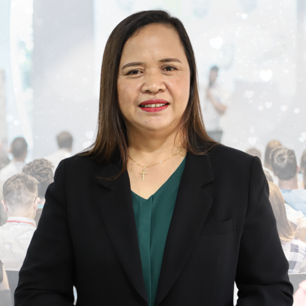 "Unit Manager Crisanta Villanueva in a formal outfit, posing confidently with a calm expression."