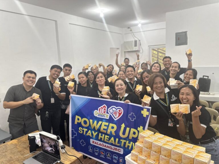 "Group of JBC Zambales sellers holding their wellness kits during the Alagang JBC health program."